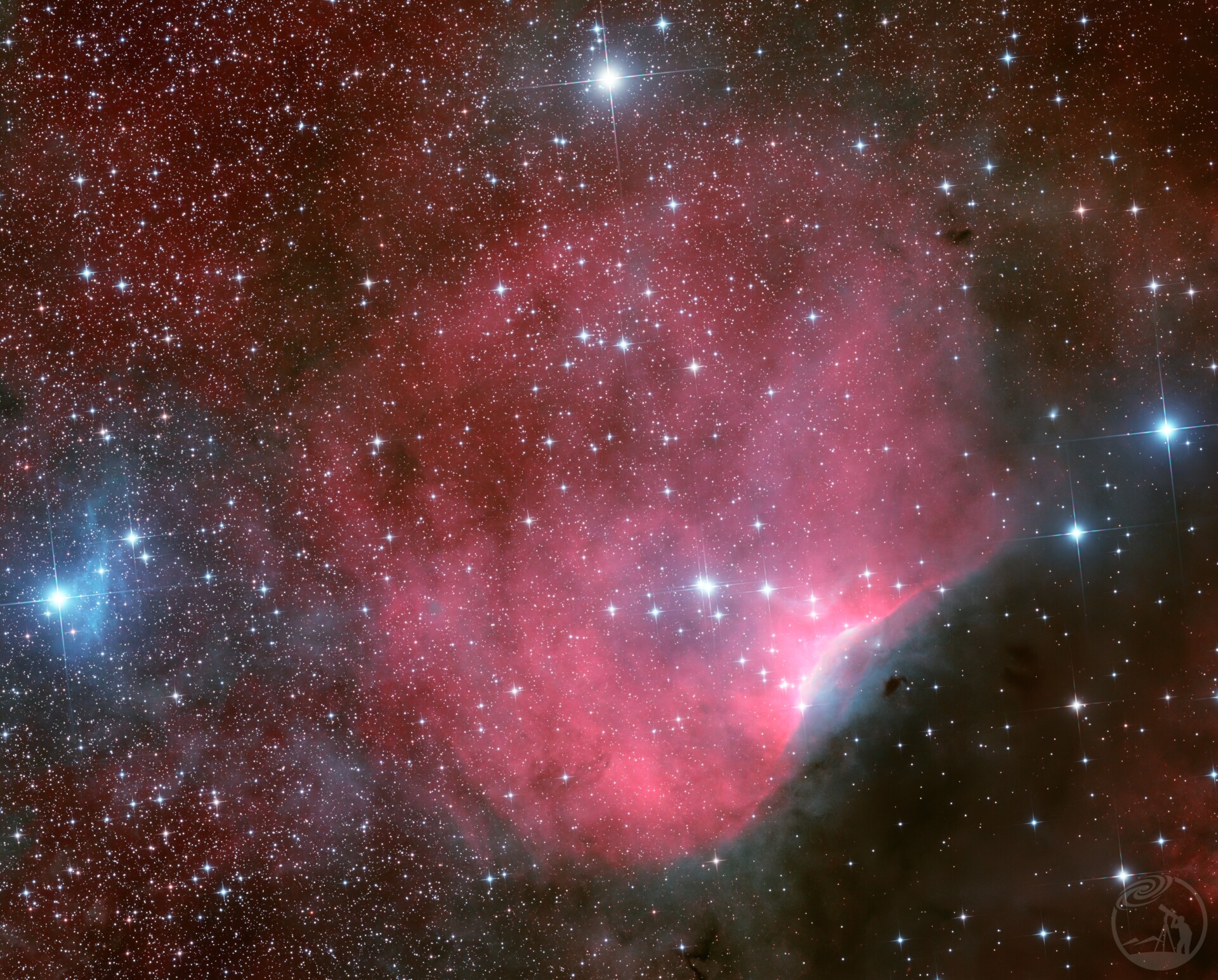 SH2-140:绯红蚌壳里的星巢